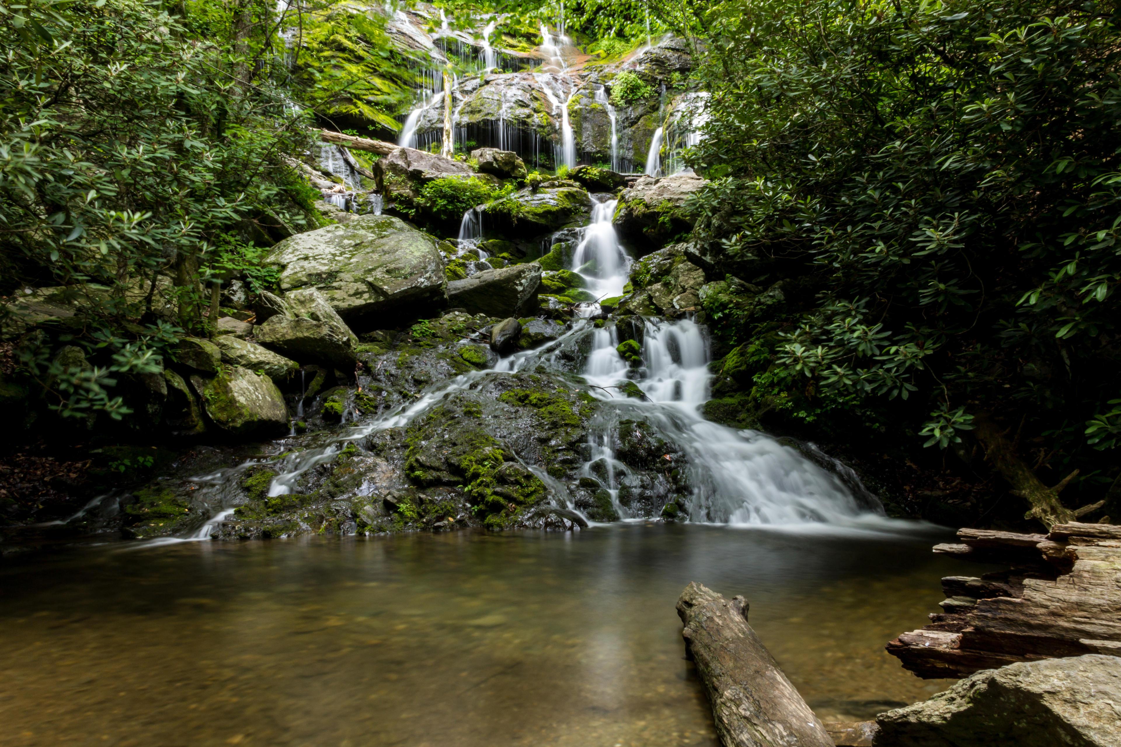 The cascade of Catawba Falls flows into a pond in Asheville