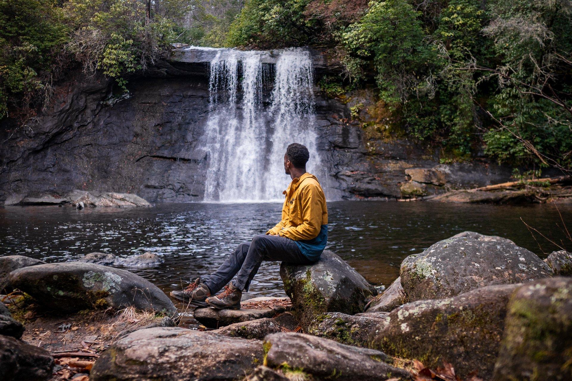 Man sitting on a rock at Silver Run Falls