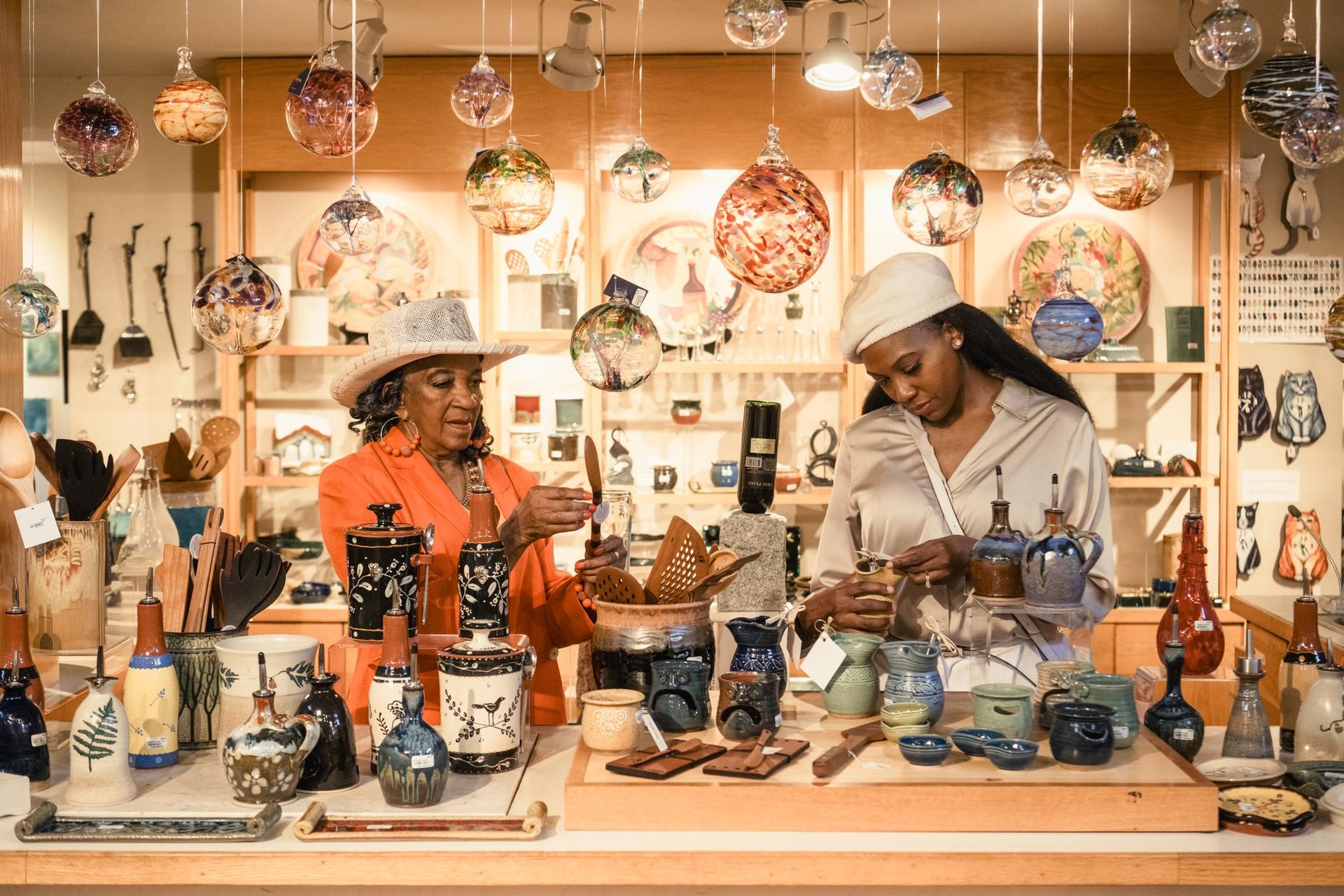 Women shopping at New Morning Gallery in Biltmore Village / Photo: Stephan Pruitt